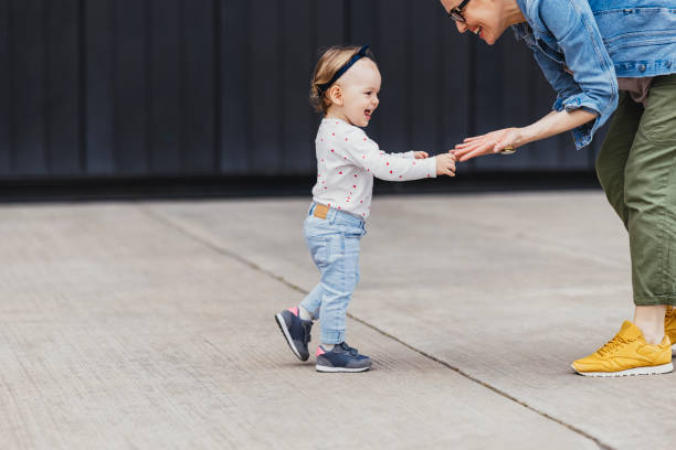 istock Mother and Daughter Playing Outside 1361618640