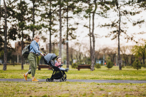 istock Mother and Daughter: A Walk in the Park 1361618649