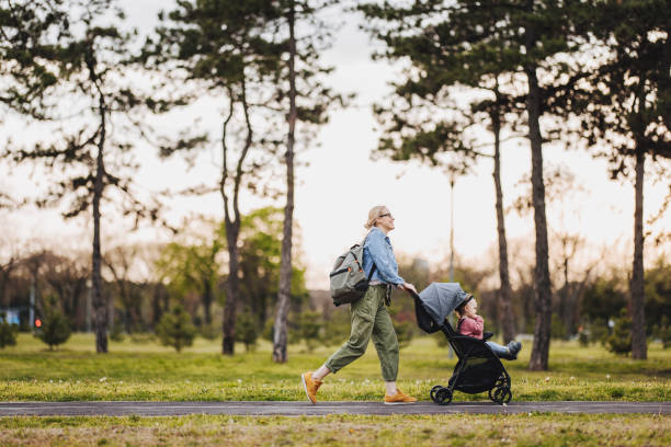 istock Mother and Daughter: A Walk in the Park 1361618650