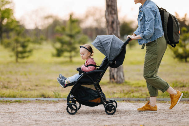 istock Mother and Daughter: A Walk in the Park 1361618654