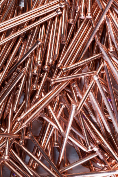 istock nails are covered with a thin layer of copper-colored metal 1361618922