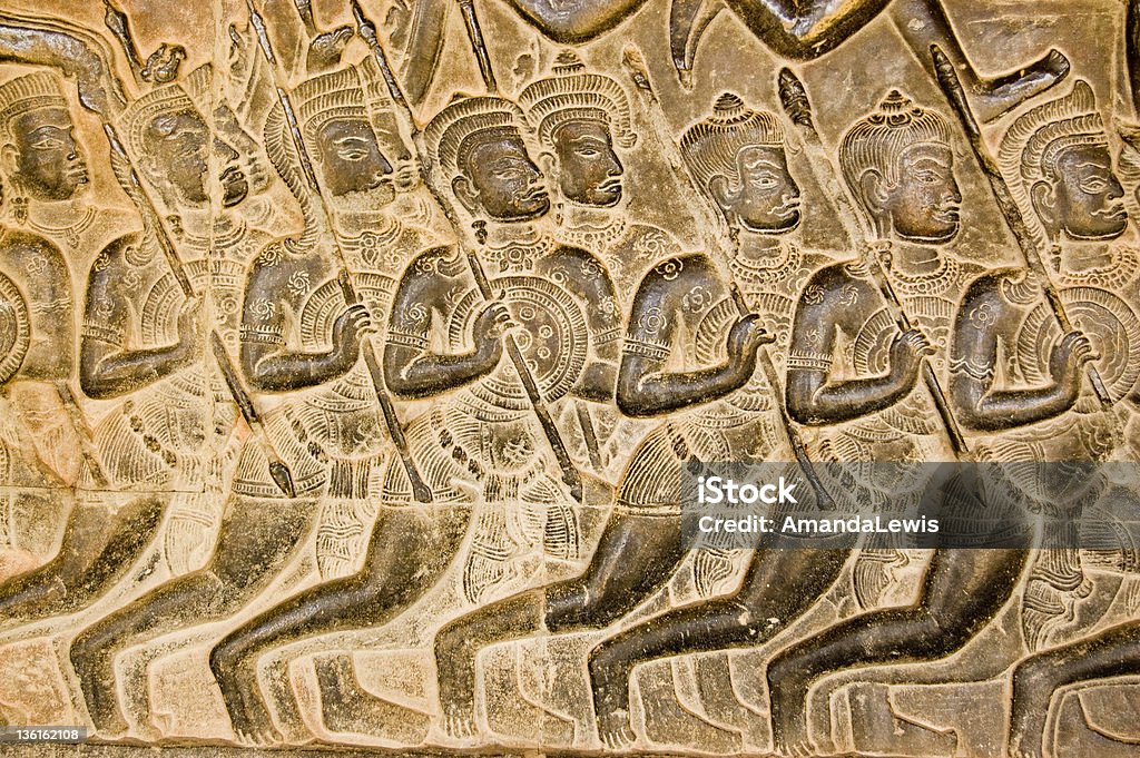 Kaurava Army bas relief, Angkor Wat Bas relief carving of Kaurava foot soldiers heading at the Battle of Kurukshetra as described in the Mahabharata.  Western Gallery of Angkor Wat, Cambodia.  Sculpted around the eleventh century. Weapon Stock Photo