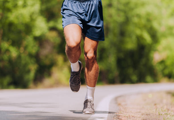 istock Man running on road in beautiful nature 1361629687