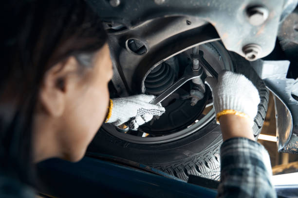 istock Talented mechanic tackling the task of replacing a car wheel 1361632251