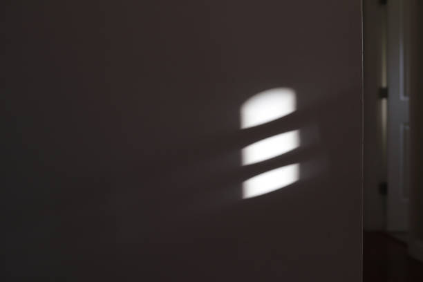 istock A shadow on a white wall inside of a home 1361633199