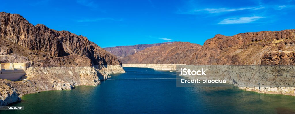 Lake Mead near Hoover Dam Panorama of Low water level strip on cliff at lake Mead. View from Hoover Dam at Nevada and Arizona border, USA Drought Stock Photo