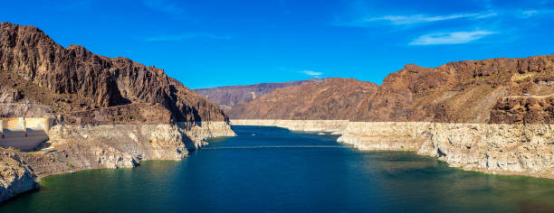 Lake Mead near Hoover Dam Panorama of Low water level strip on cliff at lake Mead. View from Hoover Dam at Nevada and Arizona border, USA colorado river photos stock pictures, royalty-free photos & images