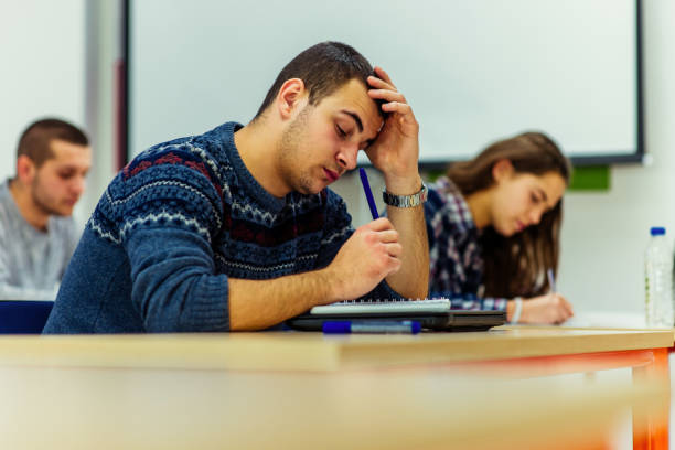 istock Group of students takes the test in class 1361637448