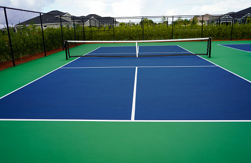 couple playing tennis in tropical climate, st. john, virgin islands