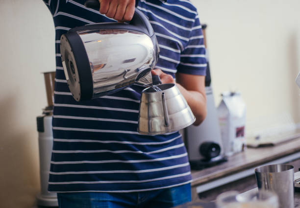 istock Coffee maker at restaurant shop preparing delicious coffee 1361639873