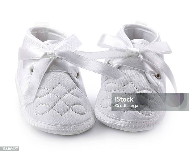 White Baby Shoes Against White Background Stock Photo - Download Image Now - Baby Booties, White Background, Cut Out