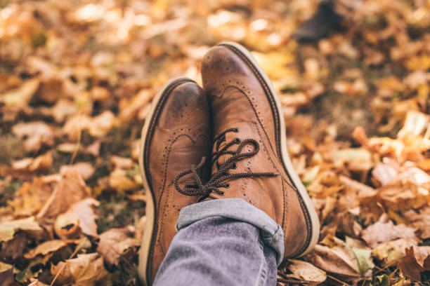 istock Brown shoes in park 1361642325