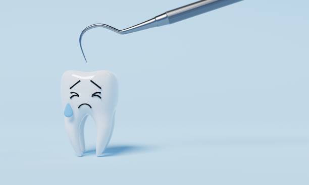 Tooth afraid of dental inspection hooks for yearly oral health check cause of tooth decay on blue background. Health care and medical concept. 3D illustration rendering stock photo