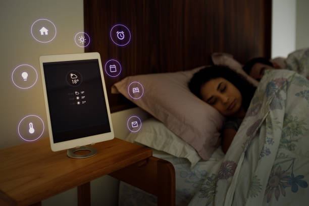 istock Digital tablet sitting on the night stand showing options of morning routine 1361654801