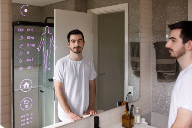 Man  looking at the smart mirror checking the data given by the impedance scale