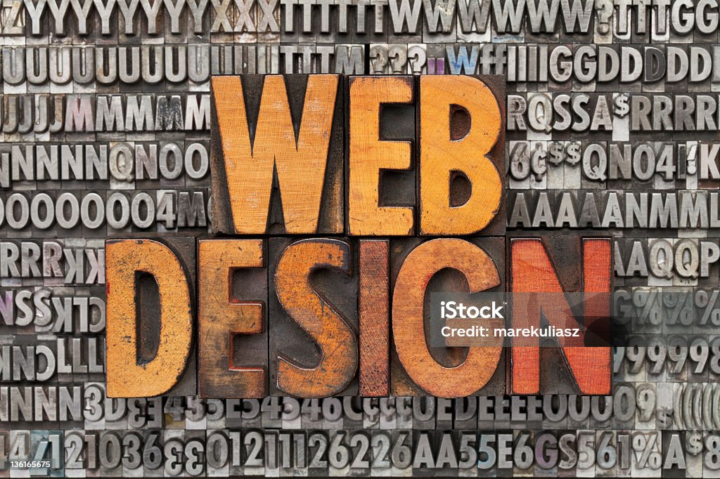Rusted metal web design letters web design - text in vintage wood letterpress printing blocks against grunge metal typeset Advertisement Stock Photo
