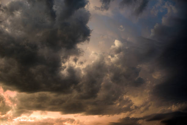 istock Low angle view of dark clouds in skyline 1361657889