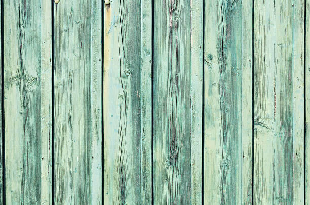 istock Light blue-green weathered wooden fence 136166450
