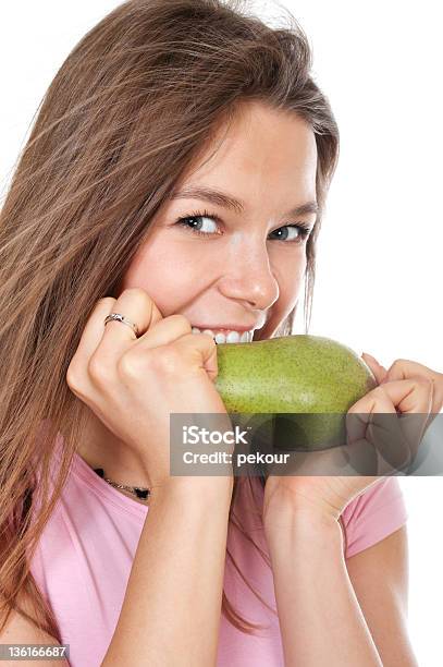 Young Happy Woman Biting Pear Stock Photo - Download Image Now - Adult, Adults Only, Beautiful People