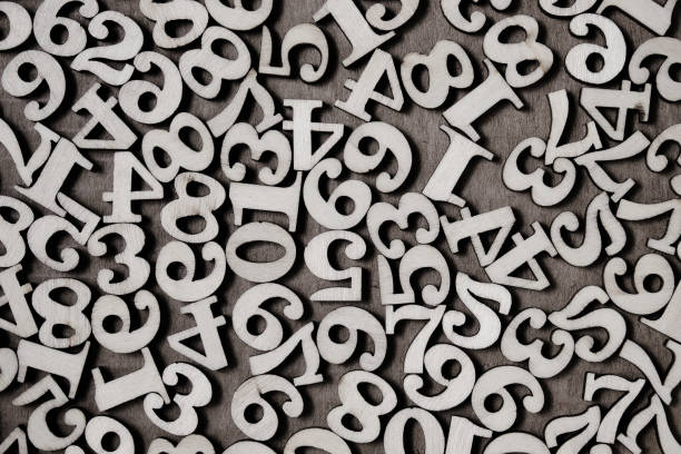 istock Wooden numbers from zero to nine on a gray background, abstract background. 1361668552