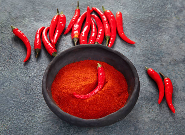 istock Red chili or chilli cayenne pepper on dark background. 1361669389