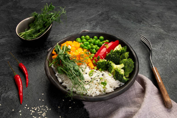 istock Bowl with rice, broccoli , pumpkin and microgreens. 1361669412
