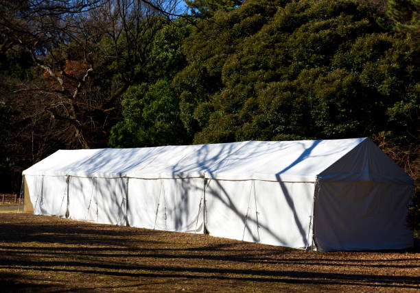 istock Big white tent in the park with sunlight 1361669445