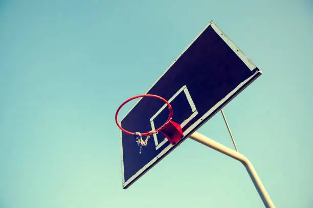 Toned Photo of the Old Basketball Board on the Sky Background