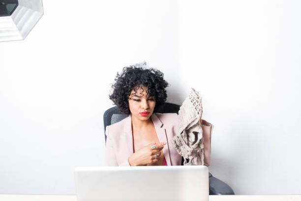 istock enterprising mexican woman showing clothes on video call 1361673438