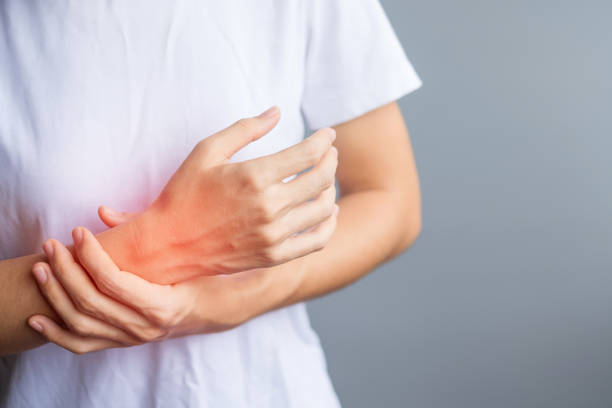 istock woman holding her wrist pain because using smartphone or computer long time. De Quervain's tenosynovitis, Intersection Symptom, Carpal Tunnel Syndrome or Office syndrome concept 1361675691