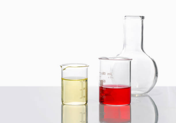 Chemical beaker with a solution, laboratory glassware, isolated on white background, studio shot