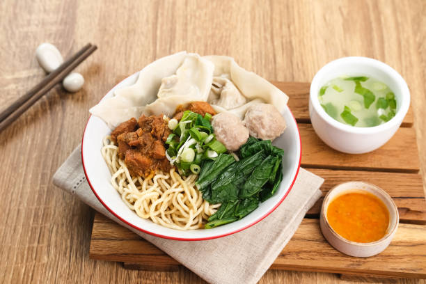 Mie ayam (noodles with chicken, meatballs, dumplings and vegetables) is a popular street food in Indonesia.