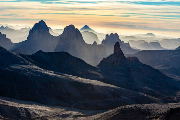 Ahaggar mountains in the sahara desert of algeria at sunrise stock photo