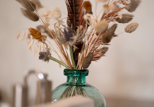 Photo of a bouquet of dried flowers in a vase