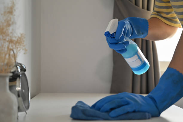 Close up view man in rubber gloves wiping dust on table with rag and spray cleaner. Close up view man in rubber gloves wiping dust on table with rag and spray cleaner. men close up 20s asian ethnicity stock pictures, royalty-free photos & images