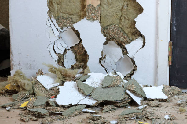 istock Breaking a wooden wall, remodeling a house 1361684625