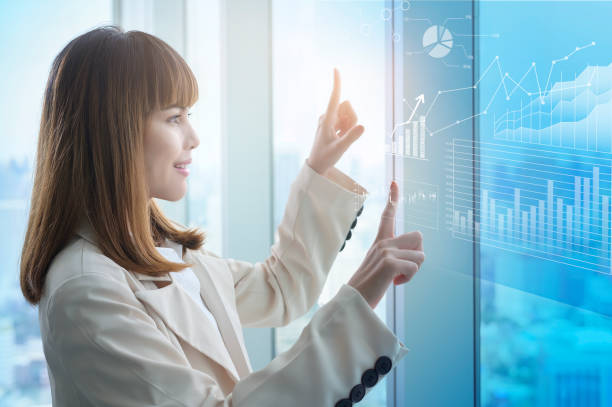 istock Young business woman hand touching on virtual screen 1361685524