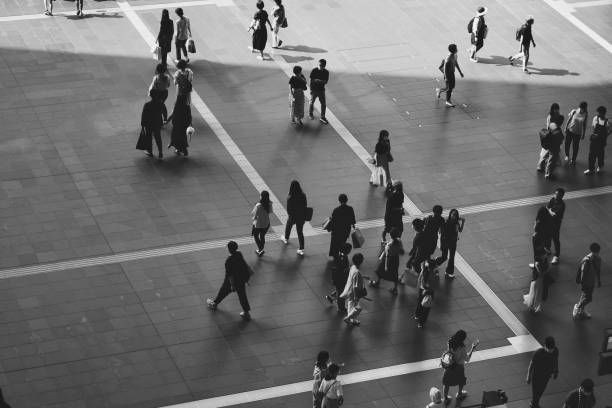 istock Many people walking in the downtown area 1361687314