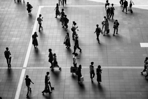 istock Many people walking in the downtown area 1361687320