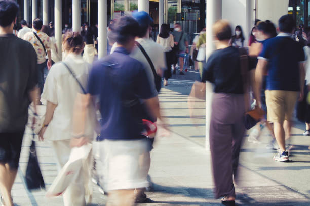 istock Many people walking in the downtown area 1361687374