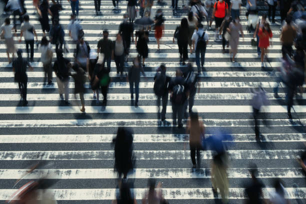 istock Many people crossing Osaka in Japan 1361687584