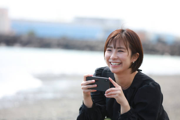 istock Female shooting with a smartphone 1361689344