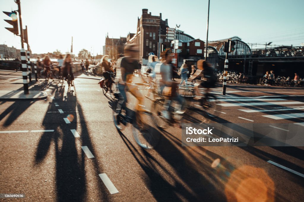Amsterdam commuters Crowded city street cyclists and pedestrians People Stock Photo
