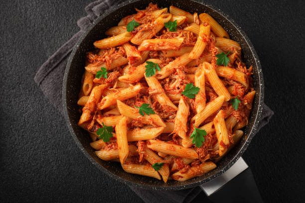 istock Frying pan CHICKEN PASTA Like an Italian top view close-up 1361691550