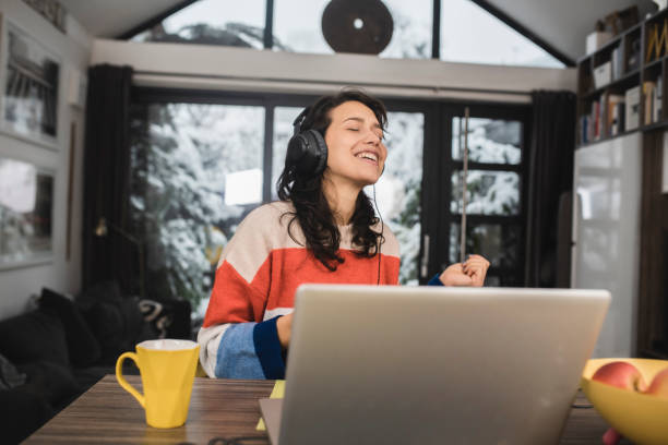 istock Young woman enjoying the music after work 1361692230
