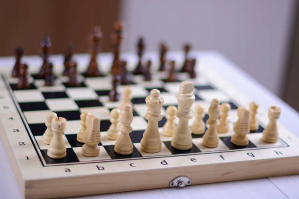 istock Black to move. White pieces in focus. 1361693556
