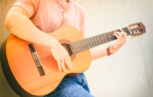 istock Trendy guy with guitar outdoor 1361697906