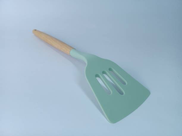 istock Green wood spatula on white background 1361698084