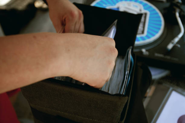 istock DJ searching vinyl record in the case 1361700046