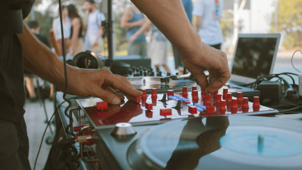istock DJ and festival goers on the background 1361700061